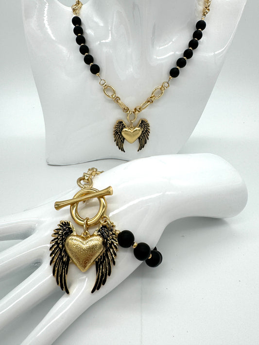 Onyx bracelet with a heart pendant with wings "Colibra"