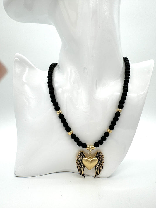 Onyx necklace with a heart pendant with colibra wings