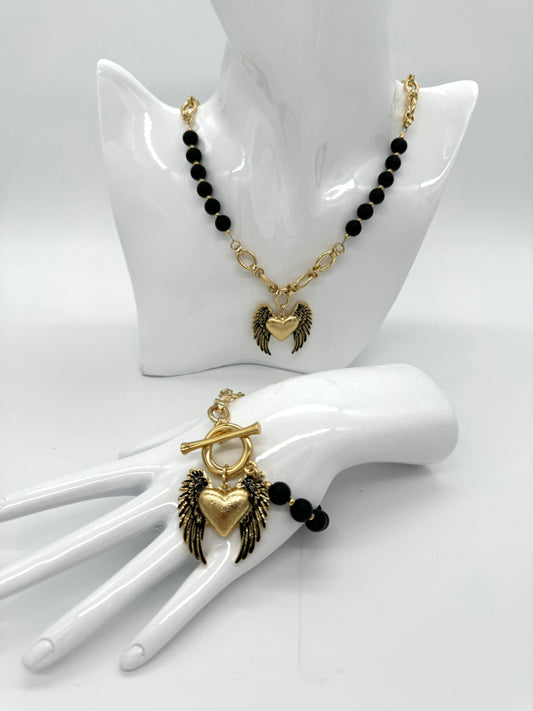 Onyx necklace with a heart pendant with colibra wings