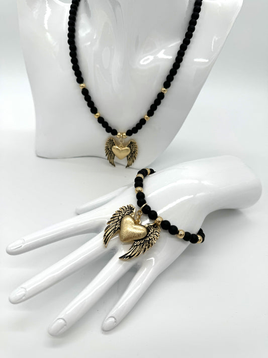 Onyx necklace with a heart pendant with colibra wings